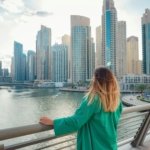 woman walks streets of Dubai, Dubai Marina