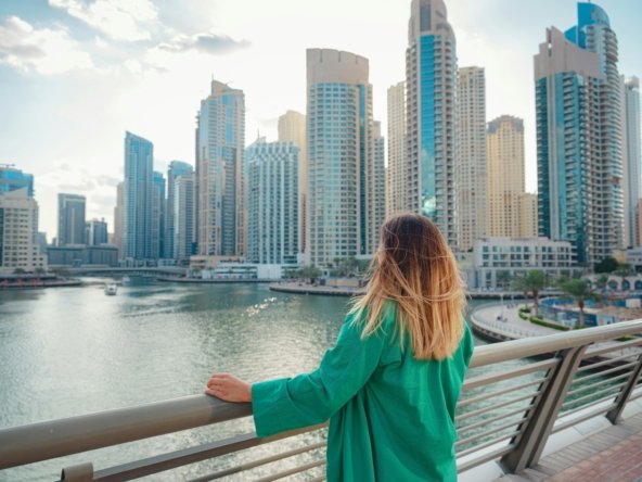 woman walks streets of Dubai, Dubai Marina